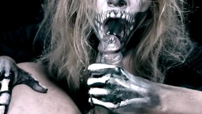Demon girl sucking cock with her black mouth and swallowing cum.